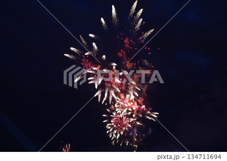 bright fireworks high in the dark sky bright fireworks high in the dark sky 134711694