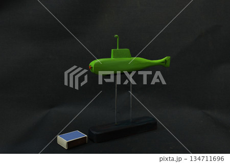 Green submarine and matchbox still life Green submarine and matchbox still life 134711696