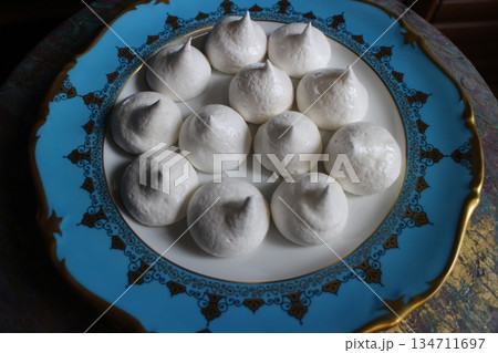 pile of white sweet meringues pile of white sweet meringues 134711697