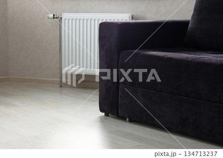 Modern radiator at home. Central heating system 134713237