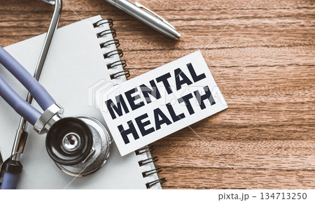 A card with text Mental Health on wooden doctor's table A card with text Mental Health on wooden doctor's table 134713250