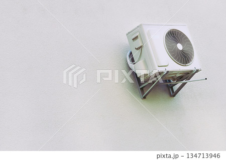 Outdoor air conditioner cooling appliance on a freshly plastered wall 134713946