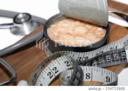 Diet and heart health concept with canned tuna. Diet and heart health concept with canned tuna. 134713988