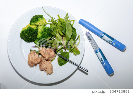Medical diet concept featuring tuna salad broccoli and Ozempic Medical diet concept featuring tuna salad broccoli and Ozempic 134713991