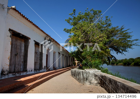 Magdalena River and the beautiful colonial streets of the Heritage Town of Santa Cruz de Mompox in Colombia. Magdalena River and the beautiful colonial streets of the Heritage Town of Santa Cruz de Mompox in Colombia. 134714496