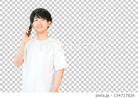 Young Asian man making a phone call on his smartphone Young Asian man making a phone call on his smartphone 134717826