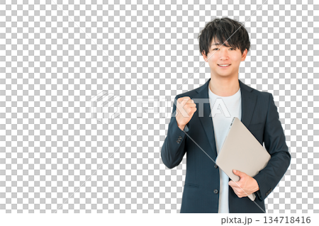 A young man of the digital native generation holding a computer (fist pump, motivation, success) A young man of the digital native generation holding a computer (fist pump, motivation, success) 134718416
