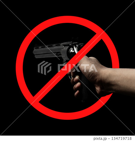 Human hand holding a revolver handgun with a red circle and diagonal line across it. Symbolize the prohibition of gun violence. Concept of gun violence Human hand holding a revolver handgun with a red circle and diagonal line across it. Symbolize the prohibition of gun violence. Concept of gun violence 134719718