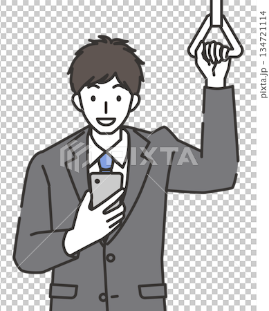 通勤中にスマホを見る笑顔のビジネスマン 134721114