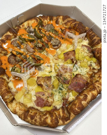 A delicious pizza with a golden crust, melted cheese, and savory toppings. Perfect for food-related designs, menus, or Italian-themed projects, capturing the essence of a classic comfort dish. 134721727