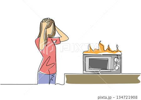 One line drawing of woman clutching her head in distress over a flaming microwave for a kitchen disaster concept. Home appliance meltdown mishap theme is for National Kitchen Klutzes of America Day. 134721908