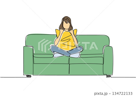 One line drawing of a woman sitting cross legged on a couch, holding and cuddling pillow to her chest, engrossed in a movie alone, symbolizing comfortable solitude and personal entertainment. One line drawing of a woman sitting cross legged on a couch, holding and cuddling pillow to her chest, engrossed in a movie alone, symbolizing comfortable solitude and personal entertainment. 134722133