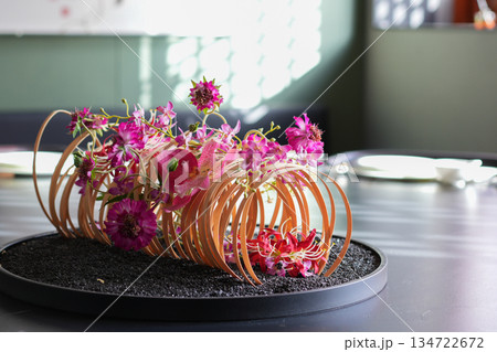 table decoration of pink flower in the dinning room table decoration of pink flower in the dinning room 134722672