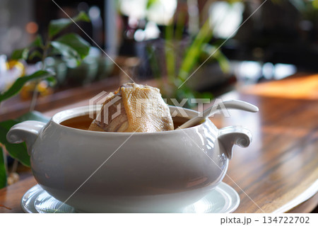 Tasty chicken soup in white bowl 134722702