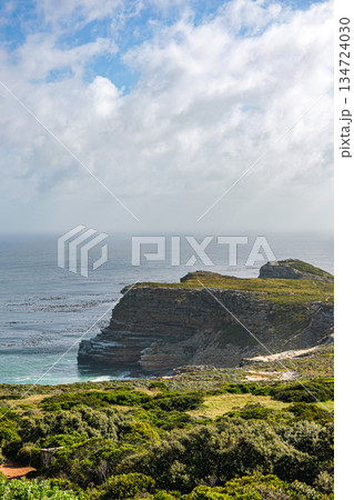 Cape point South Africa. Rocky cliff overlooking Atlantic ocean on cloudy day 134724030