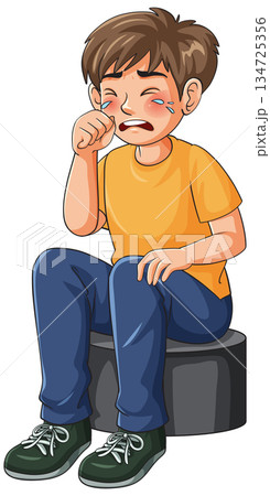 Sad Young Boy Sitting and Crying While Wiping His Tears Away 134725356