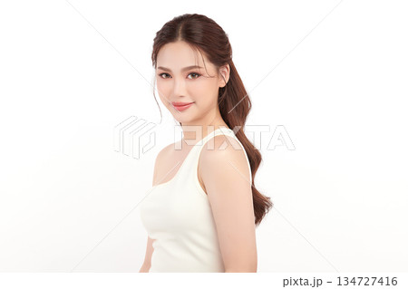 A beautiful young Asian woman with clean, fresh skin against a white background. Skincare, facial treatment, cosmetology, beauty, and spa. An elegant portrait of an Asian woman. A beautiful young Asian woman with clean, fresh skin against a white background. Skincare, facial treatment, cosmetology, beauty, and spa. An elegant portrait of an Asian woman. 134727416