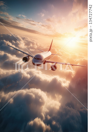 Airplane Soaring Above Clouds with Sunlight Flare in Cinematic View 134727742