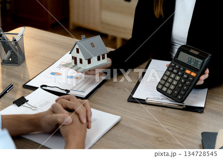 Young business woman is talking about presenting real estate Young business woman is talking about presenting real estate 134728545
