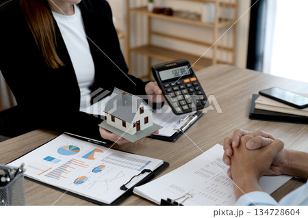 Young business woman is talking about presenting real estate Young business woman is talking about presenting real estate 134728604