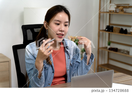 Young business woman listening and speaking explaining and sharing ideas 134728688