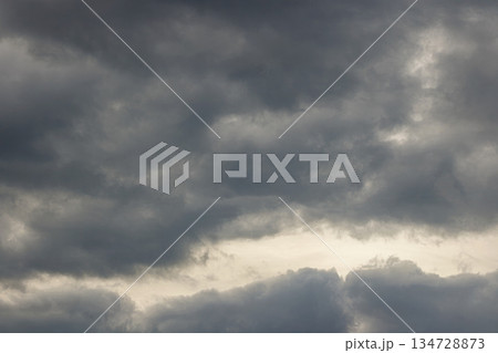 Dramatic Overcast Sky with Heavy Grey Clouds. Dark Sky before Storm Coming. Climate Concept. High quality photo 134728873