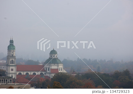 Foggy day with a church and a tower in the background Foggy day with a church and a tower in the background 134729323