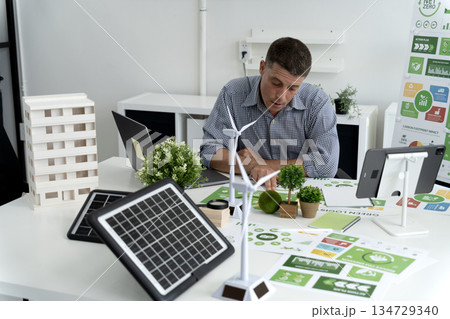 Businessman is planning for esg environmental social corporate governance projects Businessman is planning for esg environmental social corporate governance projects 134729340