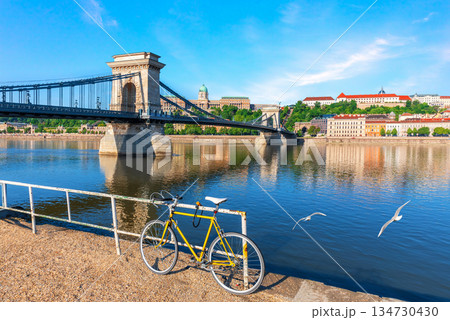 Lonely bicycle standing on the Danube River bank near Chain Bridge and Buda castle, Budapest, Hungary Lonely bicycle standing on the Danube River bank near Chain Bridge and Buda castle, Budapest, Hungary 134730430