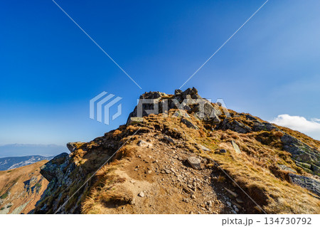 Autumn hiking trail on the ridge of Low Tatras mountains, Slovakia. 134730792