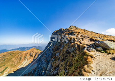 Autumn hiking trail on the ridge of Low Tatras mountains, Slovakia. 134730794