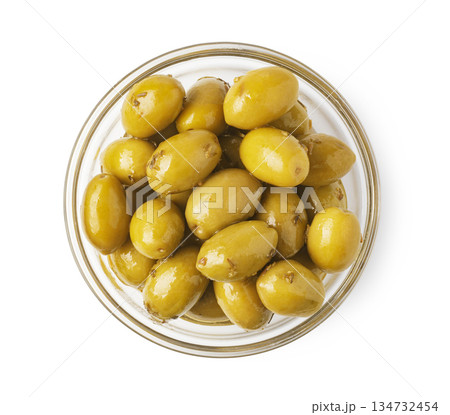 Green olives in glass bowl isolated top view 134732454