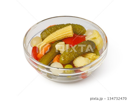Mixed pickled vegetables in glass bowl isolated Mixed pickled vegetables in glass bowl isolated 134732470