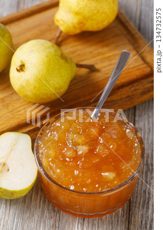 Pear jam with fresh fruit on wooden background 134732575