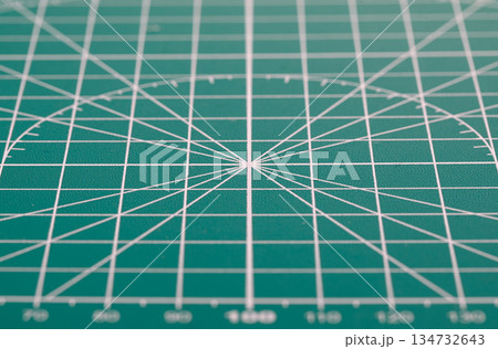 Green cutting mat surface with grid lines for precision 134732643