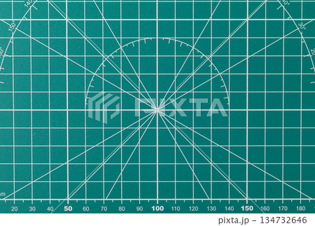 Green cutting mat with grid and measuring lines Green cutting mat with grid and measuring lines 134732646