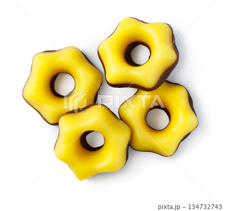 Yellow star cookies with chocolate base on white background 134732743