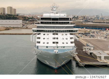 Front view of large cruise ship docked at port terminal Front view of large cruise ship docked at port terminal 134732827