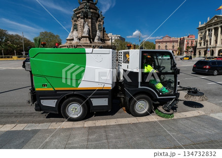 Municipal street sweeper cleaning city square on sunny day, Barcelona, Spain 134732832