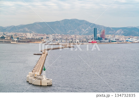 Port of Marseille. Long breakwater leading to the with green beacon, Marseille, France 134732835