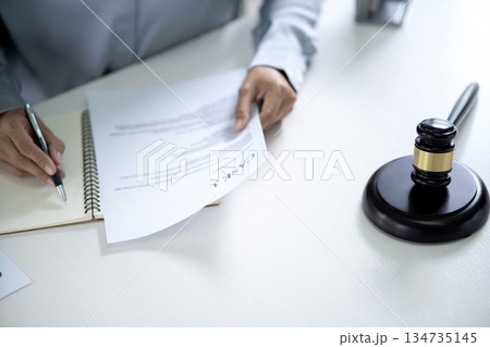 Lawyers and assistants are consulting and giving advice on legal documents 134735145