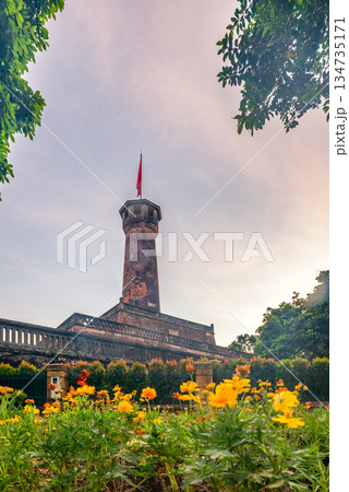 Hanoi Flag Tower with Yellow Flowers in Bloom Hanoi Flag Tower with Yellow Flowers in Bloom 134735171