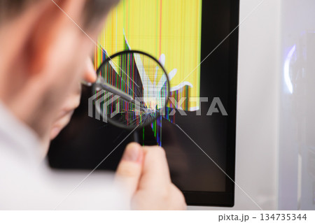 Technician inspecting a broken computer monitor display showing colorful vertical lines and a prominent crack with a magnifying glass, indicating electronic repair diagnosis Technician inspecting a broken computer monitor display showing colorful vertical lines and a prominent crack with a magnifying glass, indicating electronic repair diagnosis 134735344