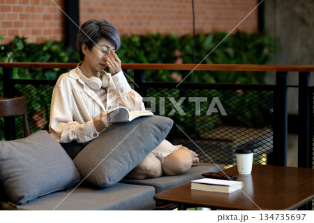Elderly woman is squeezing relax her eyes to relieve stress and fatigue 134735697