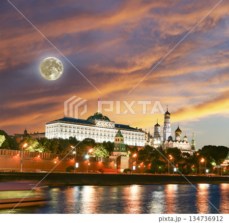 Night view of the Moskva River and Kremlin, Russia, Moscow (most popular view). Against the background of a beautiful sky with clouds, with the moon 134736912
