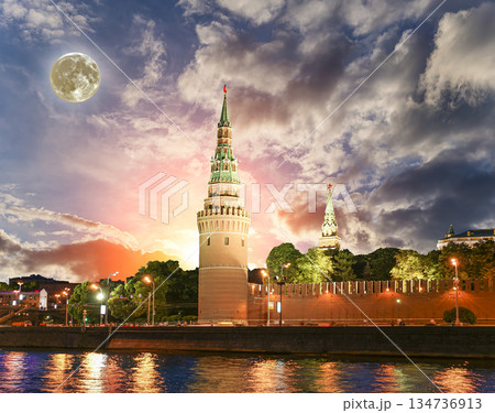 Night view of the Moskva River and Kremlin, Russia, Moscow (most popular view). Against the background of a beautiful sky with clouds, with the moon Night view of the Moskva River and Kremlin, Russia, Moscow (most popular view). Against the background of a beautiful sky with clouds, with the moon 134736913