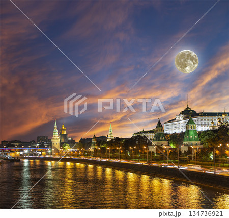 Night view of the Moskva River and Kremlin, Russia, Moscow (most popular view). Against the background of a beautiful sky with clouds, with the moon Night view of the Moskva River and Kremlin, Russia, Moscow (most popular view). Against the background of a beautiful sky with clouds, with the moon 134736921