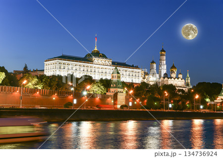 Night view of the Moskva River and Kremlin, Russia, Moscow (most popular view). Against the background of a beautiful sky with clouds, with the moon Night view of the Moskva River and Kremlin, Russia, Moscow (most popular view). Against the background of a beautiful sky with clouds, with the moon 134736924