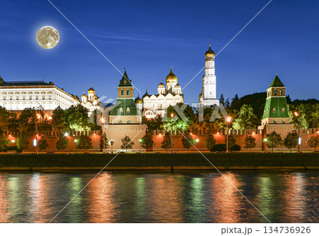 Night view of the Moskva River and Kremlin, Russia, Moscow (most popular view). Against the background of a beautiful sky with clouds, with the moon 134736926