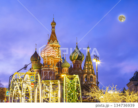 Saint Basil cathedral (Temple of Basil the Blessed) and Christmas (New Year holidays) decoration, Red Square, Moscow, Russia (at night with the super moon). Journey to Christmas, Moscow seasons 134736939